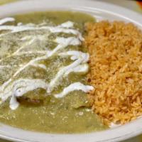 Carne Asada Enchiladas · Grilled steak enchilada with rice, beans and sauce.