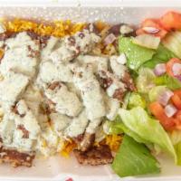 Gyro & Chicken Mix Over Rice · Gyro and chicken meat mixed with peppers and onions served with rice, salad and white sauce.