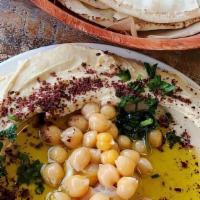 Hummus · Ground chickpeas, tahini paste, lemon, oil and salt.