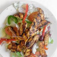 Grilled Chicken Salad · Choice of Small of Large for an additional charges.
Tossed green salad topped with grilled c...