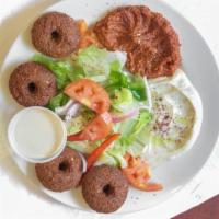 Falafel Platter · Choice of Plain Pita and Whole Wheat Pita  for an additional charges.
Served with salad, hum...