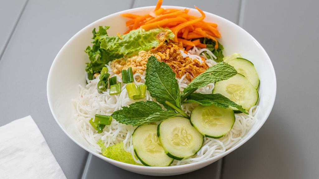 Rice Vermicelli Salad · Lettuce, cucumber, mint leaves and rice vermicelli topped with scallion oil, fried red onion and roasted peanuts served with Vietnamese vinaigrette on the side.