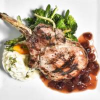 Berkshire Pork Chop · Grilled Berkshire pork chop stuffed with brie cheese and scarole Grand Marnier and cranberry...