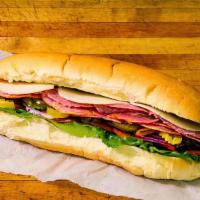 Hard Salami Sub · Lettuce, tomato, onion, hot pepper relish, cheese, banana peppers, pickle slices and olives.