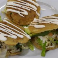 Gordita De Chicharron · 3 mini corn pancakes, stuffed with chicharron, lettuce, cheese, sour cream, pico de gallo an...