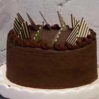 Triple Chocolate Cake · This moist triple chocolate cake is a three layer chocolate cake. The cake is filled with wh...