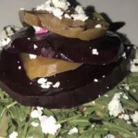 Beet Tower (Tg) · Red and yellow beets topped with walnuts and goat cheese over arugula with balsamic vinaigre...