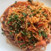 Lobster Spaghetti · Butter poached lobster with spicy tomato ragu, toasted breadcrumbs and parsley.