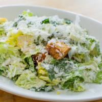 Kale Caesar Salad · Brioche croutons and Parmesan dressing.