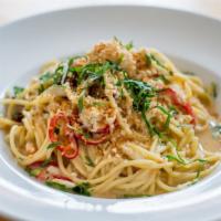 Blue Crab Spaghetti · Lump crab, tomatoes, chiles, and breadcrumbs.