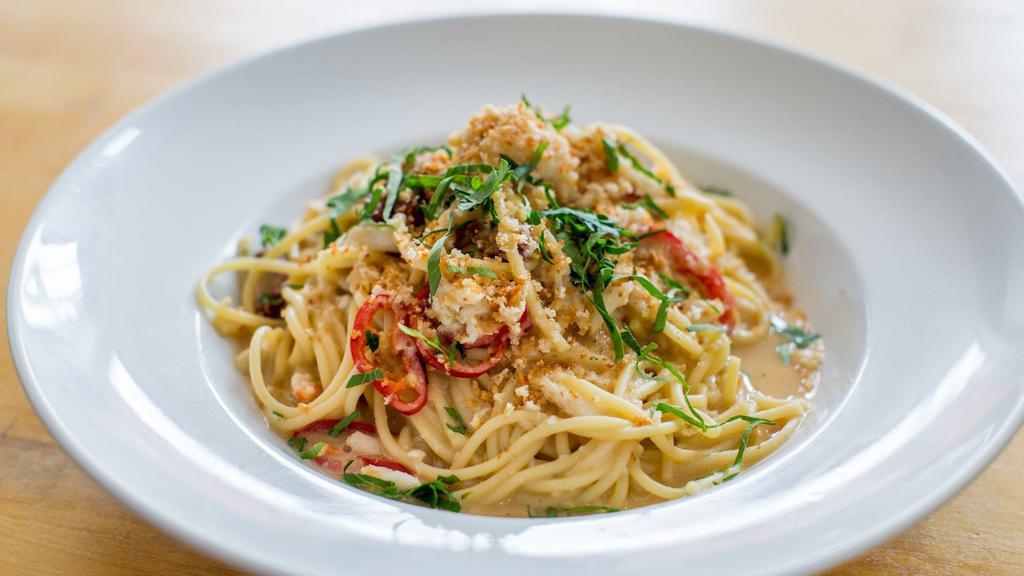 Blue Crab Spaghetti · Lump crab, tomatoes, chiles, and breadcrumbs.