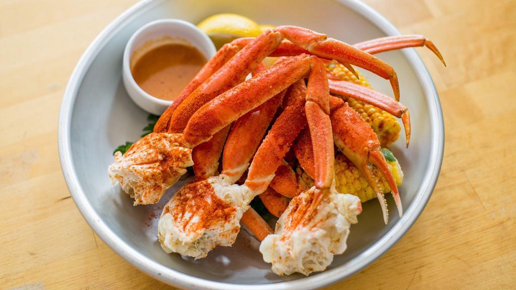 Snow Crab Legs Boil · Tossed with old bay garlic butter. Served with garlic butter corn and potatoes.