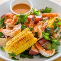 Jumbo Tiger Shrimp Boil · Tossed with old bay garlic butter. Served with garlic butter corn and potatoes.