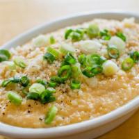 Creamy Parmesan Grits · Cracked pepper and scallion.