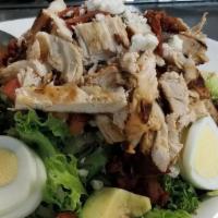 Cobb Salad · Grilled chicken over a bed. of mixed greens, avocado,. bacon, blue cheese crumbles,. tomato,...