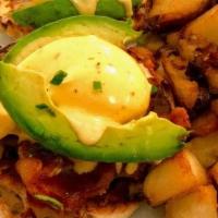 California Benny · Two poached eggs over avocado . and tomato, topped with hollandaise. sauce, served on a toas...