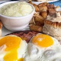 Southern Fixins Breakfast · Two eggs any style, ham, grits, biscuits, Sweet Mama's sawmill sausage gravy and homefries