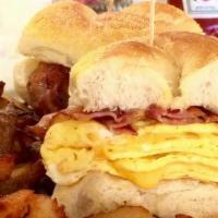 Egg And Cheese Sandwich With Meat · Two eggs any style with your choice of cheese on a kaiser roll with choice of bacon, sausage...