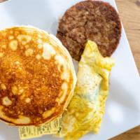 Deluxe Pancakes · Three pancakes, eggs, bacon, or sausages.