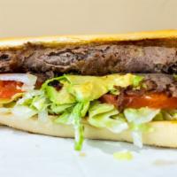 Steak Sandwich · Served with lettuce, tomato, onion, avocado, and mayonnaise on a grilled long roll.