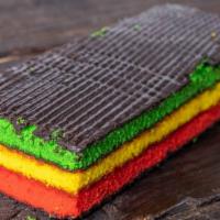 Hand-Dipped Rainbow Cookies · Cookie or cake? A rainbow of four cake layers, filled with jam, and then hand-dipped in choc...