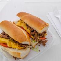 Chopped Cheese  · Made on a grill with ground beef, onions, and topped by melted cheese and served with lettuc...