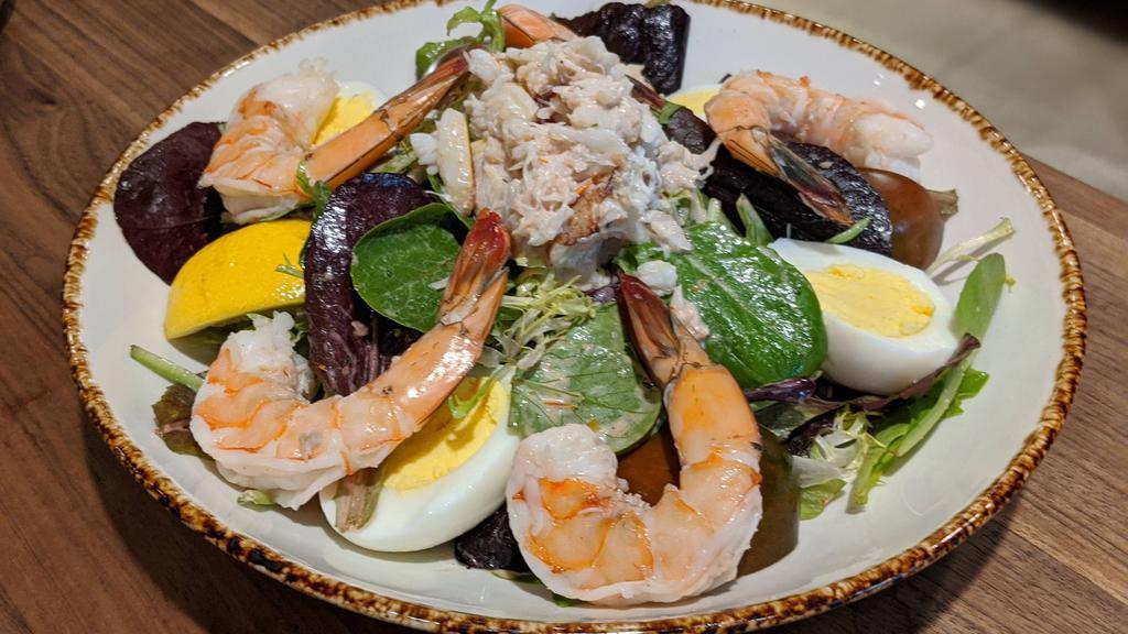 Chilled Shrimp & Crab Louis † · Gluten free organic baby greens, egg, heirloom tomatoes, louis dressing 470 cal.