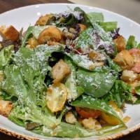 Simple Salad · Organic baby greens, heirloom tomatoes, garlic croutons, parmesan cheese, creamy garlic vina...