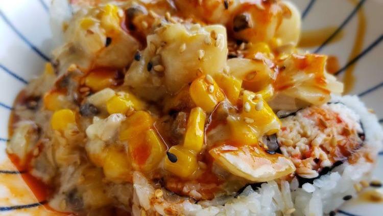 Seafood Dynamite · Panfried shrimp, scallops, mushroom, onion, corn, topped with cheese