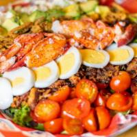 Cobbster Salad · Traditional cobb salad with bacon, blue cheese, tomatoes, egg, crispy onions and avocado wit...