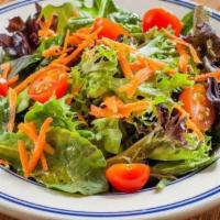 Green Salad · Cherry tomatoes, cucumbers, and greens tossed in basil vinaigrette dressing.