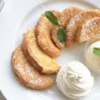 Buttermilk French Toasts (3 Pcs) · Classic french toasts with side of butter and syrup.