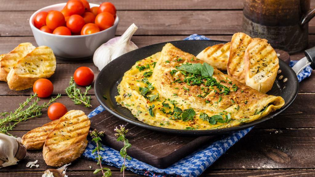 Greek Omelette · Greek style omelette with feta cheese, olives, tomatoes, onions and peppers.