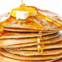 Buttermilk Pancakes (3 Pcs) · Warm buttermilk pancakes served in stack of three with side of butter and syrup.