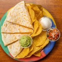 Classic Quesadilla · Melted jack & cheddar cheese in a 12” flour tortilla served with chips
