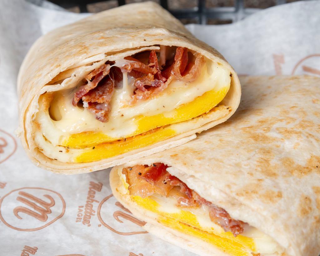 Breakfast Omelet Wrap · Omelet made with three eggs, American cheese and your choice of meat.