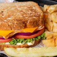 Turkey & Cheddar Sandwich · Most popular. Turkey cheddar, lettuce, tomato, onion, and mayonnaise. Served with pickle and...