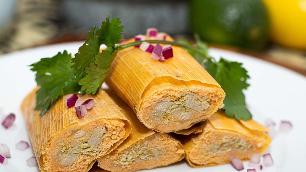 Chicken Tamales (3 Pieces) · Boneless chicken breast and thighs in a homemade mild green salsa and masa harina. Covered with a dry corn husk.