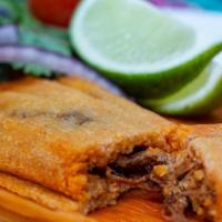 Pork Tamales (3 Pieces) · Pork shoulder simmered in a homemade guajillo sauce (not spicy) and masa harina. Covered wit...