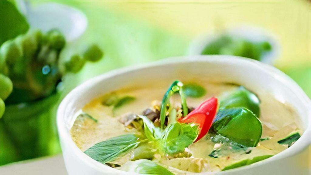 Green Curry · Green curry cooked with coconut milk, bamboo shoots, bell pepper, green bean, eggplant, carrot, and basil.