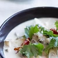 Tom Kha (Coconut Soup) · Flavorful sour mixture with Thai herbs, coconut milk, mushroom, onion and carrot, tomato, gr...