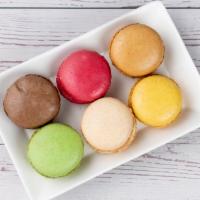 Macaron Collection · A set of 6 French style macarons: 
Vanilla, chocolate, caramel, raspberry,
lemon, pistachio