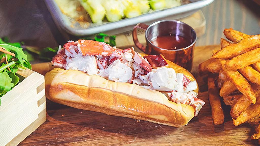 Lobster Roll · Lobster Roll Served with light mayo and black truffle oil with  a side of Cajun Fries