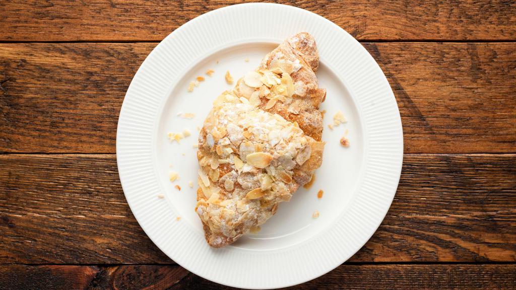 Almond Croissant · Buttery and flaky pastry with almonds.