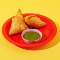 Chicken Samosa · Filled with chicken and peas.
