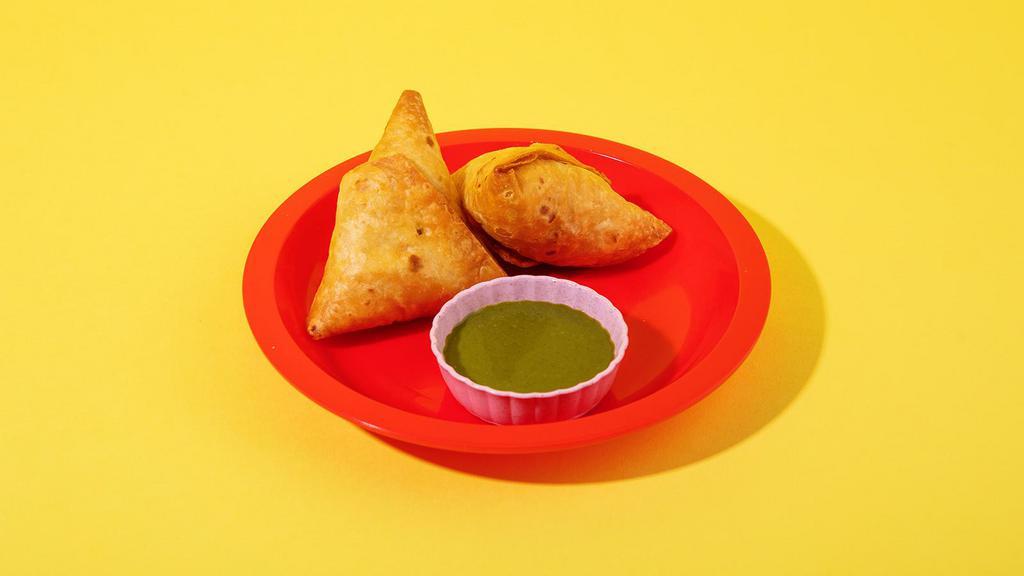 Chicken Samosa · Filled with chicken and peas.