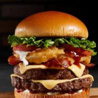 Bbq Bacon Tribeca Burger · 7oz choice burger topped with cheddar, BBQ sauce, bacon, and a crispy onion ring on a brioch...