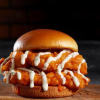 Buffalo Chicken Sandwich · Hand-breaded chicken breast tossed in mild buffalo sauce and topped with melted swiss. Serve...