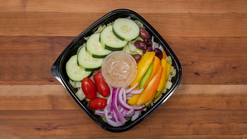 Italian Salad · Chopped romaine salad, tomatoes, kalamata olives, cucumbers, mixed bell peppers, and our homemade Italian dressing.