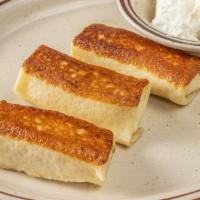 Cheese Blintzes · Served with sour cream or apple sauce on a bed of lettuce.
